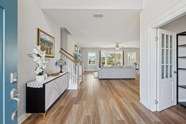 foyer entrance featuring ceiling fan and light hardwood / wood-style floors