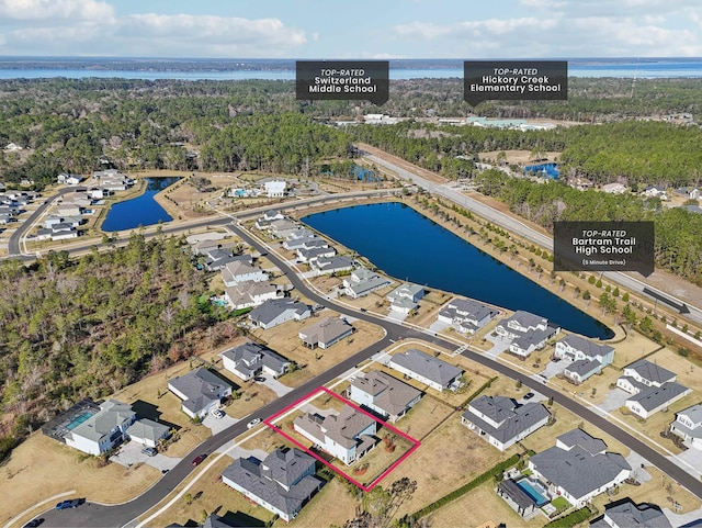 birds eye view of property featuring a water view