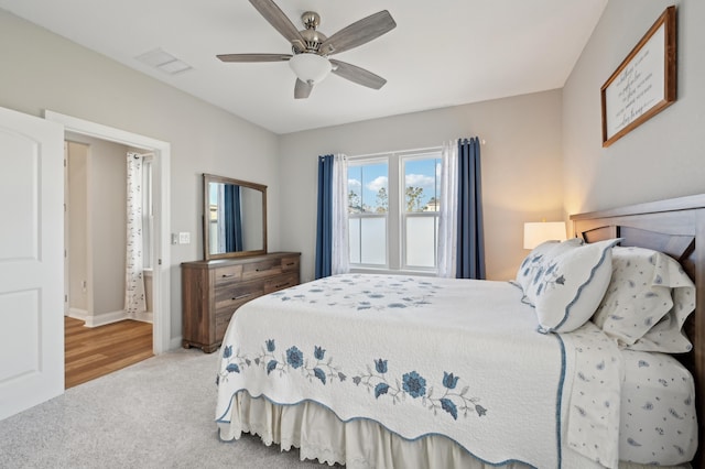 bedroom featuring ceiling fan and light colored carpet