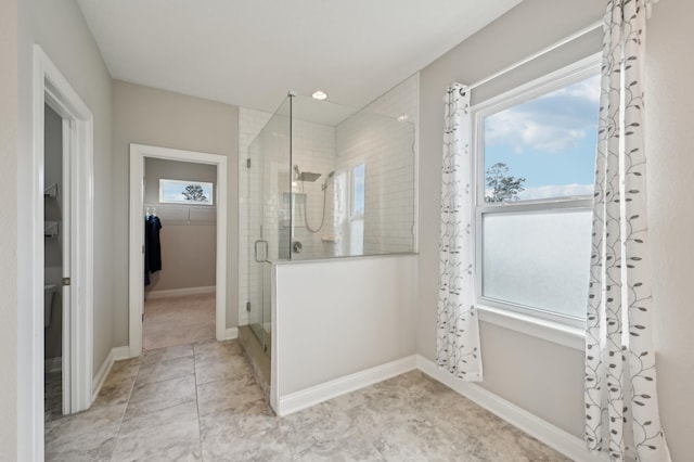 bathroom featuring an enclosed shower