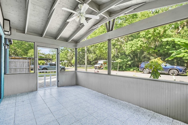 unfurnished sunroom with a ceiling fan