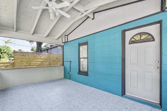 doorway to property with ceiling fan