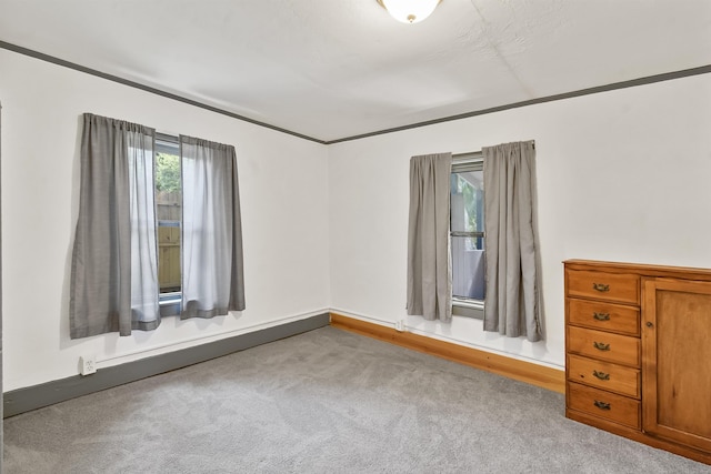 unfurnished bedroom with carpet and baseboards