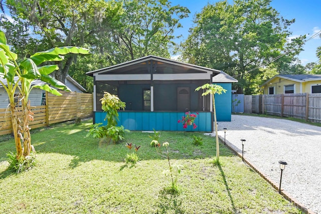 view of front of property with a sunroom