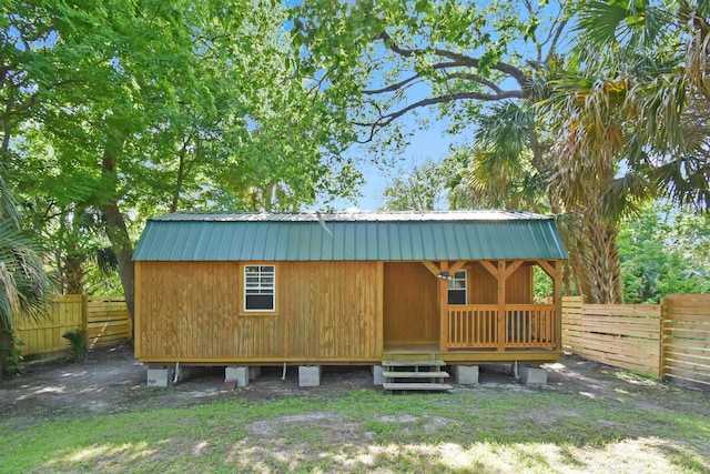 view of outdoor structure featuring a fenced backyard