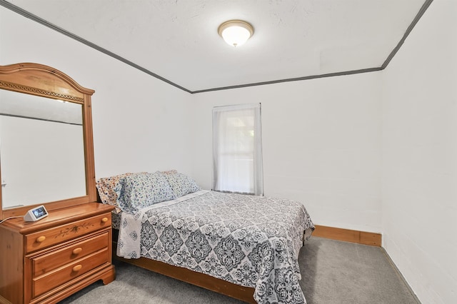 bedroom with carpet flooring and baseboards