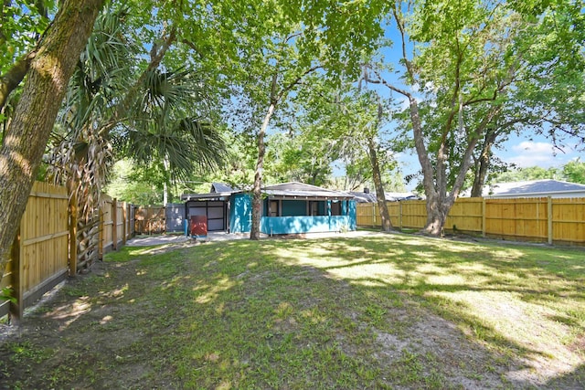 view of yard featuring a sunroom