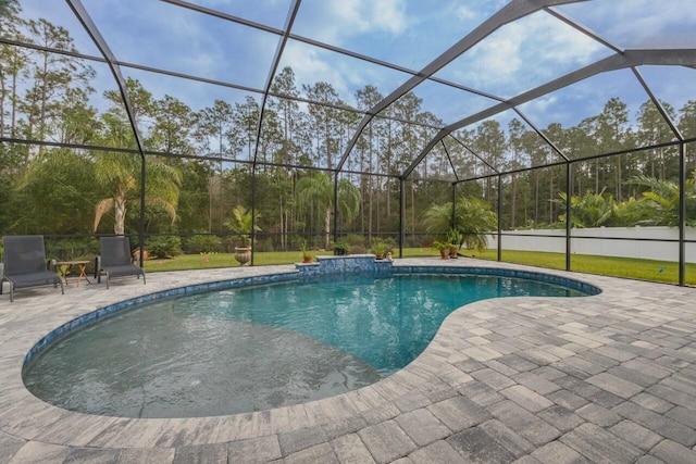 view of pool with a lanai and a patio area