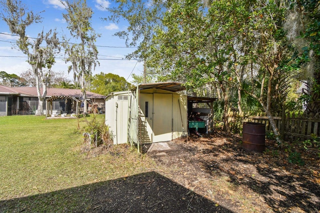 view of shed featuring fence