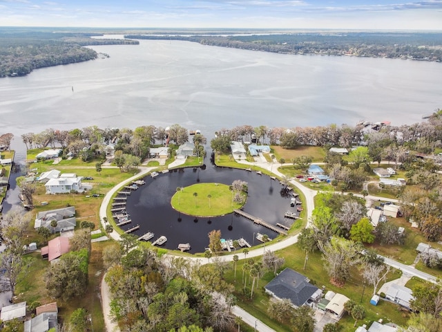 birds eye view of property with a water view and a residential view