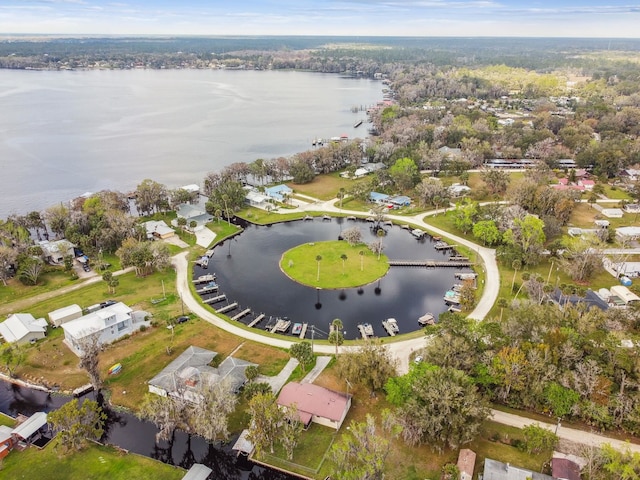 birds eye view of property with a water view and a residential view