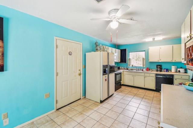 kitchen featuring light tile patterned floors, light countertops, a sink, white fridge with ice dispenser, and dishwasher