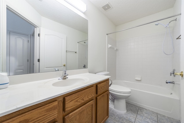 full bath featuring visible vents, toilet, a textured ceiling, tile patterned flooring, and vanity