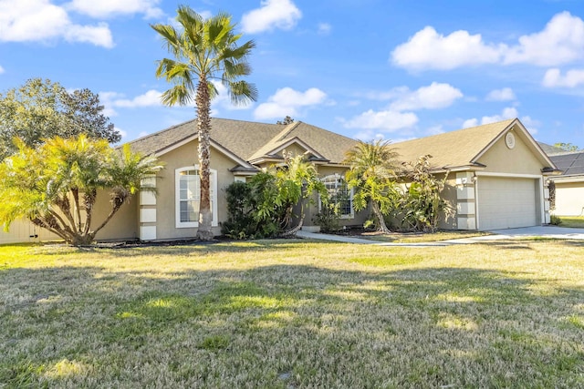 view of front of house with stucco siding, an attached garage, driveway, and a front lawn