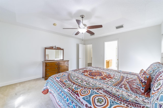 carpeted bedroom with baseboards, visible vents, and ceiling fan