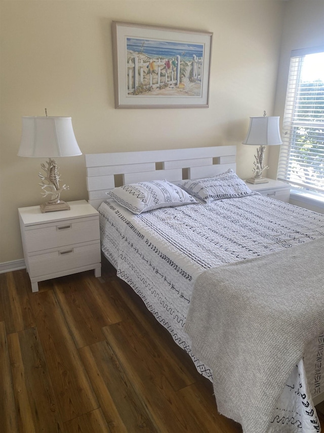 bedroom featuring dark wood-type flooring