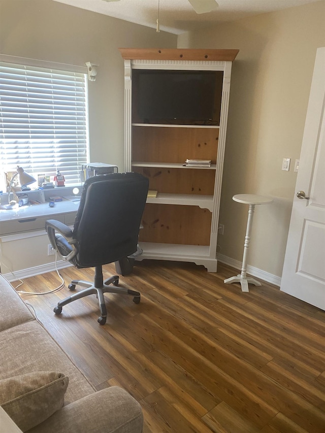 office space featuring baseboards and wood finished floors