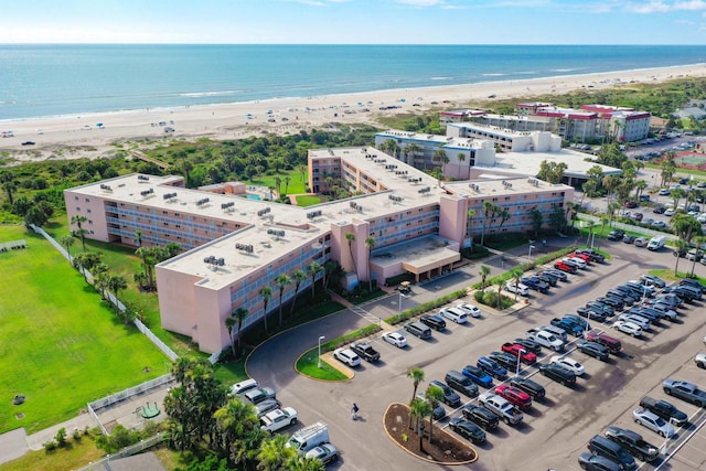 bird's eye view featuring a view of the beach and a water view