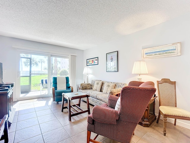 tiled living room with a textured ceiling