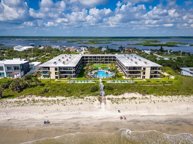 bird's eye view with a water view and a view of the beach