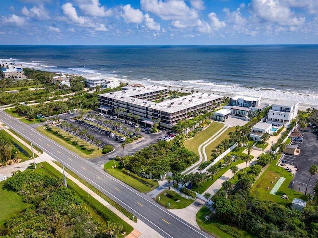 bird's eye view featuring a water view and a view of the beach