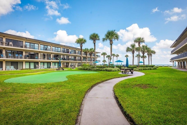 view of home's community with a lawn