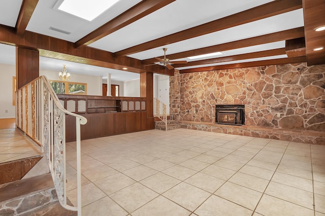 6433 Jack Wright Island Rd, Saint Augustine, FL 32092 - unfurnished living room featuring beam ceiling, a chandelier, a ceiling fan, tile patterned flooring, and a fireplace