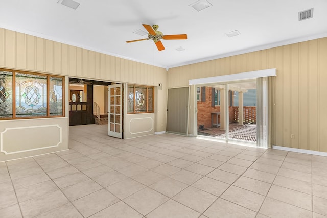 6433 Jack Wright Island Rd, Saint Augustine, FL 32092 - empty room with ceiling fan, healthy amount of natural light, crown molding, and light tile patterned flooring