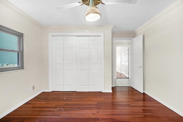6433 Jack Wright Island Rd, Saint Augustine, FL 32092 - unfurnished bedroom with wood finished floors, ornamental molding, a closet, and a ceiling fan