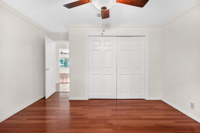 6433 Jack Wright Island Rd, Saint Augustine, FL 32092 - unfurnished bedroom featuring wood finished floors, a closet, ornamental molding, and ceiling fan