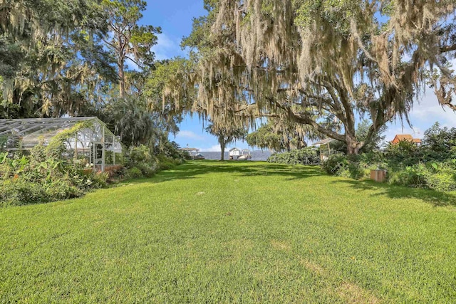 6433 Jack Wright Island Rd, Saint Augustine, FL 32092 - view of grassy yard featuring a greenhouse and an outbuilding