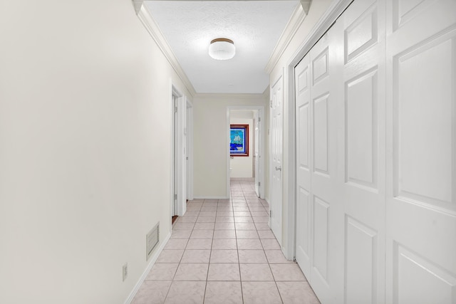 6433 Jack Wright Island Rd, Saint Augustine, FL 32092 - hallway featuring ornamental molding, light tile patterned floors, and a textured ceiling
