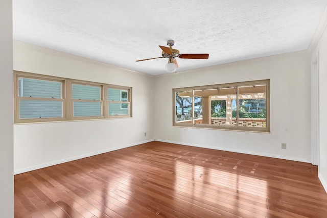 6433 Jack Wright Island Rd, Saint Augustine, FL 32092 - unfurnished room featuring a textured ceiling, a ceiling fan, wood-type flooring, and crown molding
