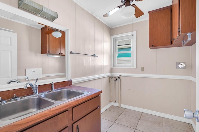 6433 Jack Wright Island Rd, Saint Augustine, FL 32092 - kitchen with ceiling fan, brown cabinetry, crown molding, light tile patterned floors, and light countertops
