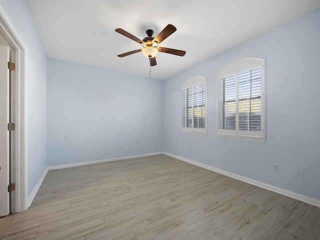 unfurnished room with ceiling fan and light hardwood / wood-style flooring