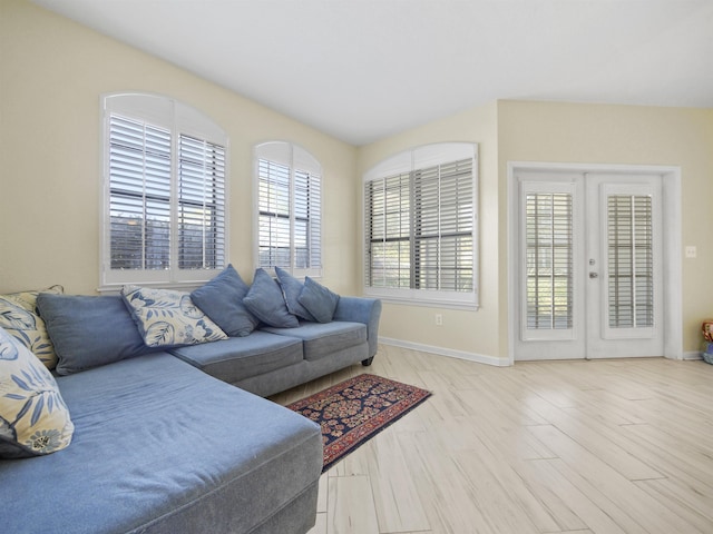 living room featuring light wood-type flooring and french doors