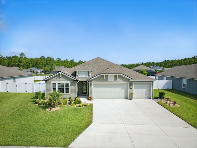 view of front facade featuring a gate, an attached garage, and concrete driveway