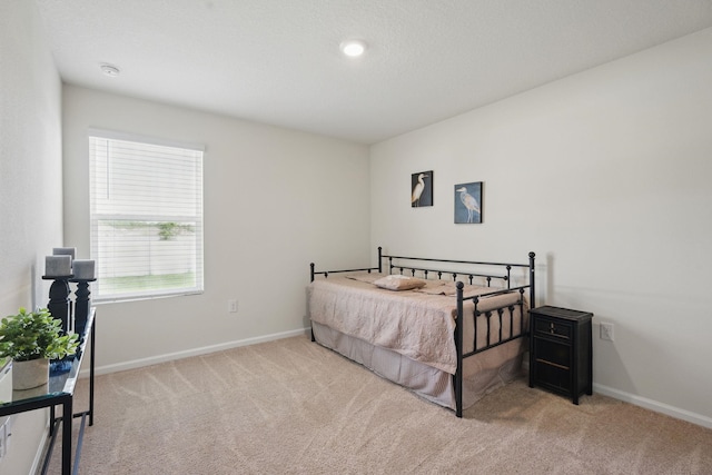 carpeted bedroom with baseboards