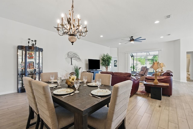 dining area with light wood-type flooring, ceiling fan, recessed lighting, a chandelier, and baseboards