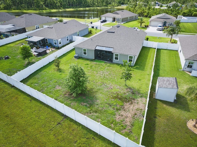 aerial perspective of suburban area with a nearby body of water