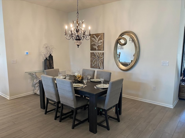 69 Hickory Ridge Rd, Saint Augustine, FL 32084 - dining area with a chandelier and wood finished floors