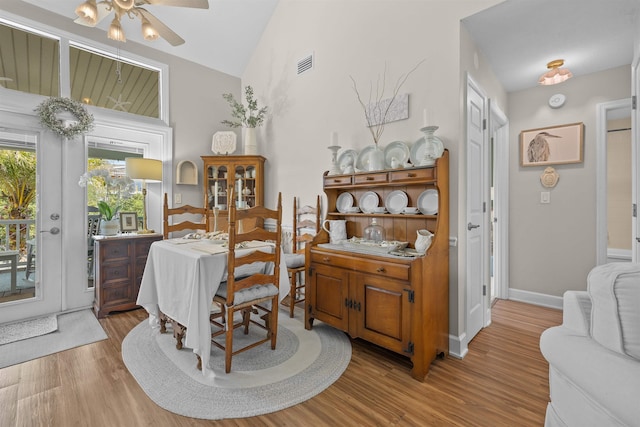 6600 Nassau St, Saint Augustine, FL 32080 - dining area with wood finished floors, a ceiling fan, vaulted ceiling, and baseboards