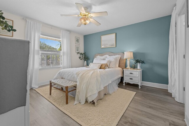 6600 Nassau St, Saint Augustine, FL 32080 - bedroom featuring baseboards, wood finished floors, and a ceiling fan