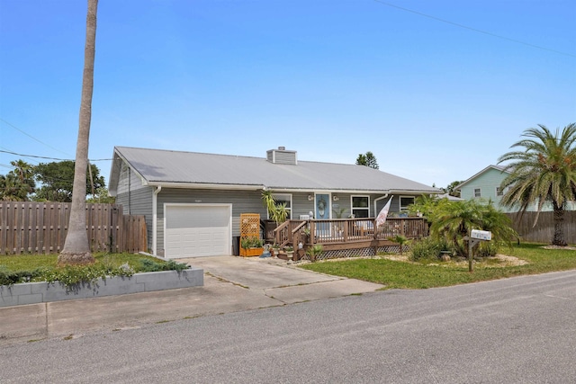 6600 Nassau St, Saint Augustine, FL 32080 - ranch-style home featuring an attached garage, concrete driveway, metal roof, a chimney, and a porch
