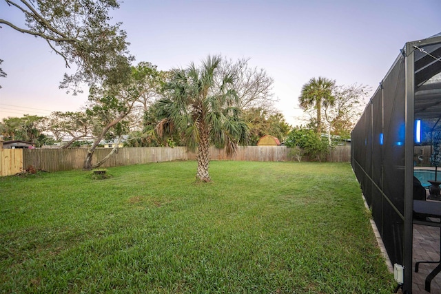 yard at dusk with a lanai