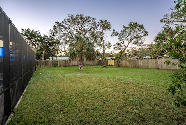 view of yard at dusk