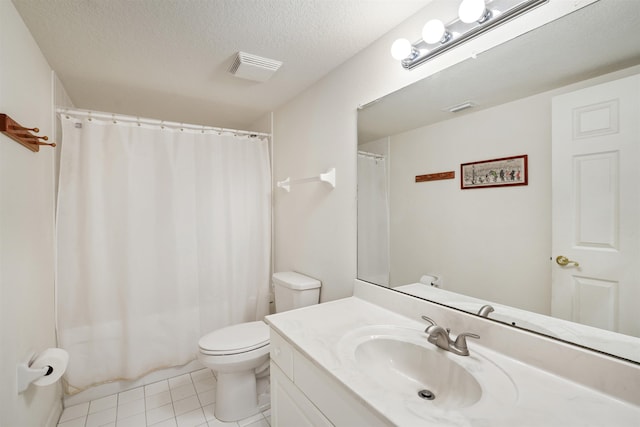155 Marine St Unit 202, Saint Augustine, FL 32084 - bathroom featuring vanity, tile patterned floors, a textured ceiling, and a shower with shower curtain