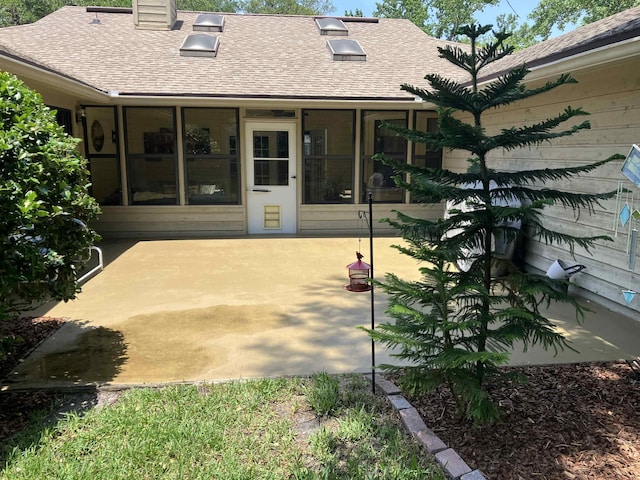 1076 Mainsail Ln, Saint Johns, FL 32259 - rear view of house featuring a shingled roof, a patio, and a chimney