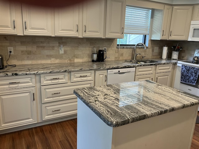 1076 Mainsail Ln, Saint Johns, FL 32259 - kitchen featuring white appliances, a sink, dark wood-style floors, and white cabinetry