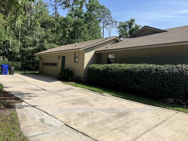 1076 Mainsail Ln, Saint Johns, FL 32259 - view of property exterior featuring an attached garage, driveway, and roof with shingles
